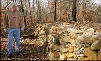 Tom Hendrix walks along a section of a rock wall he built as a memorial to his great-great-grandmother, a Yuchi Indian who was driven from Lauderdale County to Oklahoma on the Trail of Tears. DANIEL GILES/TimesDaily